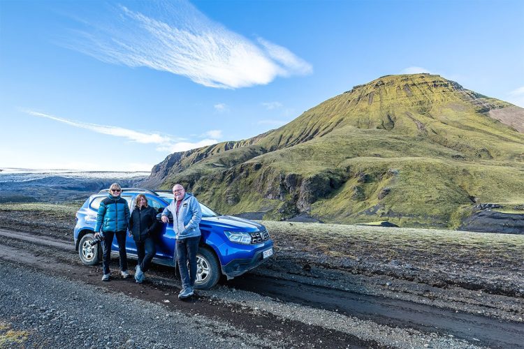 Group shot in front of our off roader vehicle, "Dusty".