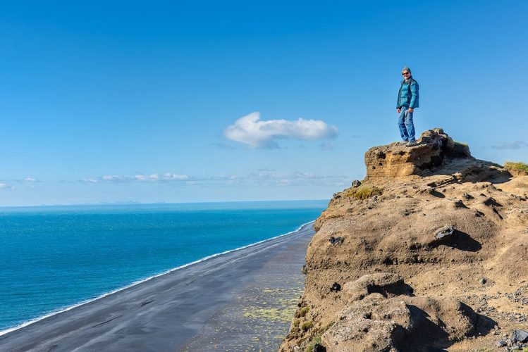 Joyce overlooking the Black Sand Beach at Dyrhólaey