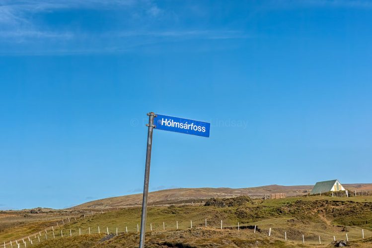 Direction sign to another waterfall. Any place ending in "foss" is a waterfall.